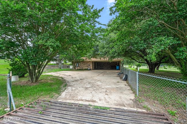 View of front facade with concrete driveway | Image 32