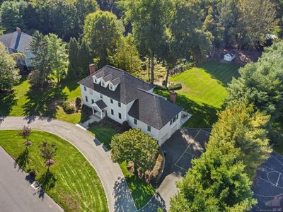 Aerial view showing the beautiful 1.35 acres that offers tons of enjoyment.. endless outdoor entertaining, volleyball in the summer, sledding in the winter, @home "driving range" and more. half circle front driveway perfect for day to day &amp; guests | Image 3