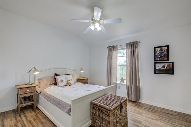 3rd bedroom upstairs has a view of the golf course and features LVP flooring. | Image 18