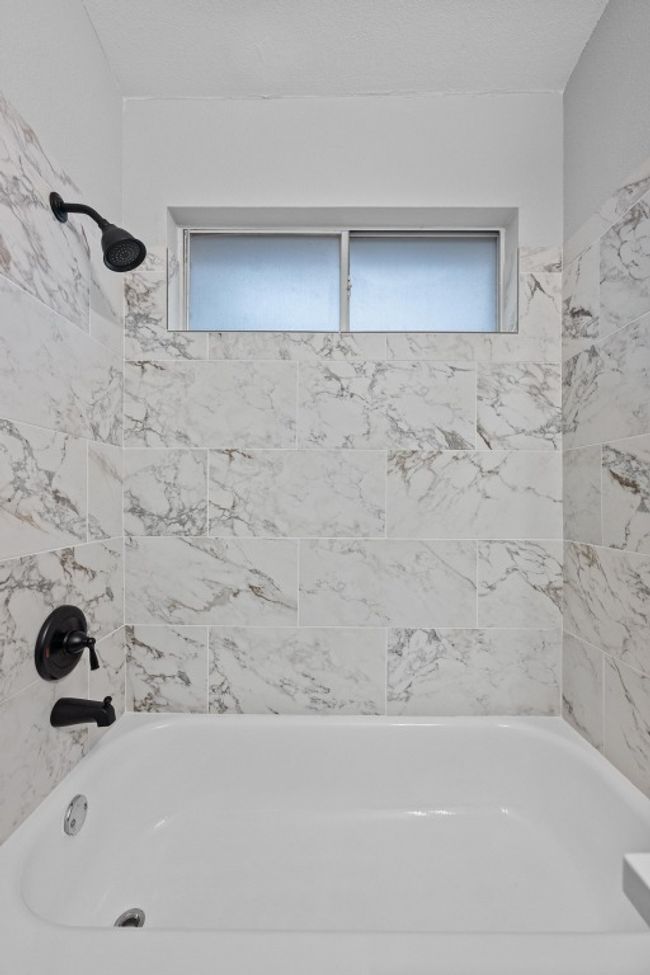 Bathroom with re-finished shower / bathtub combination | Image 20