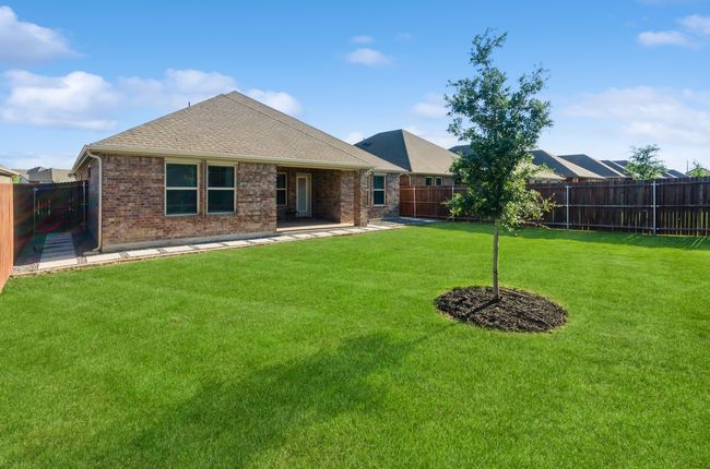 Rear view of property with brick siding, a patio, and roof with shingles | Image 29