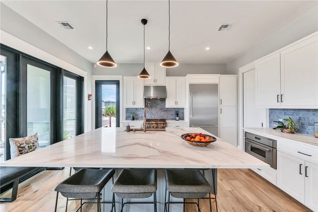 Kitchen island seats 5. | Image 14
