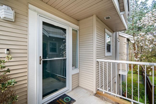 Property entrance with a balcony | Image 32