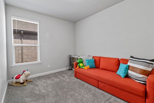 Sitting room with carpet flooring and baseboards | Image 11