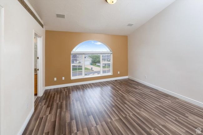 Unfurnished room featuring dark wood-type flooring | Image 16
