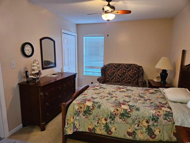 Bedroom with light carpet and ceiling fan | Image 20