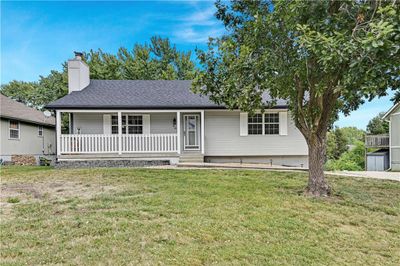 View of front facade with a front lawn and covered porch | Image 1