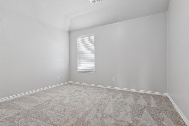 Upstairs bedroom with carpet flooring, baseboards, and visible vents | Image 27