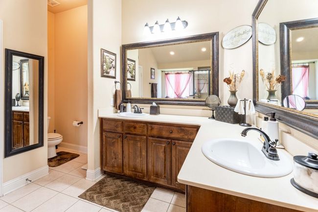 Full bath featuring double vanity and tile floors | Image 23