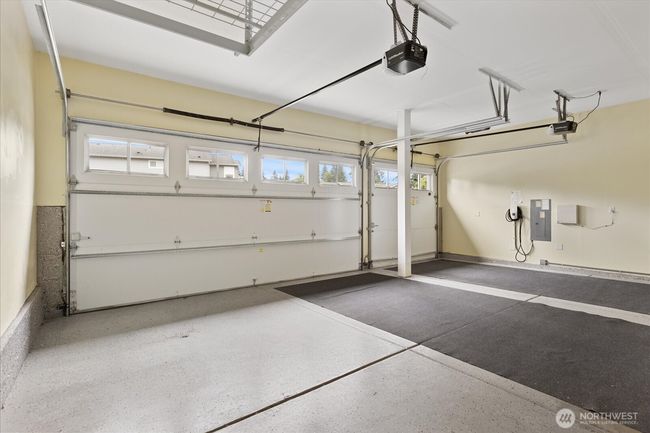 Long and tall 3 car garage with EV charging | Image 32