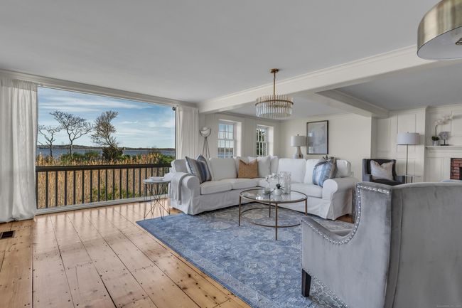 Offering The Perfect Blend Of Old And New The Living Room With A Gracious Water View Features A Corner Fireplace, Gleaming Wide-Board Floors And Exposed Beams | Image 15