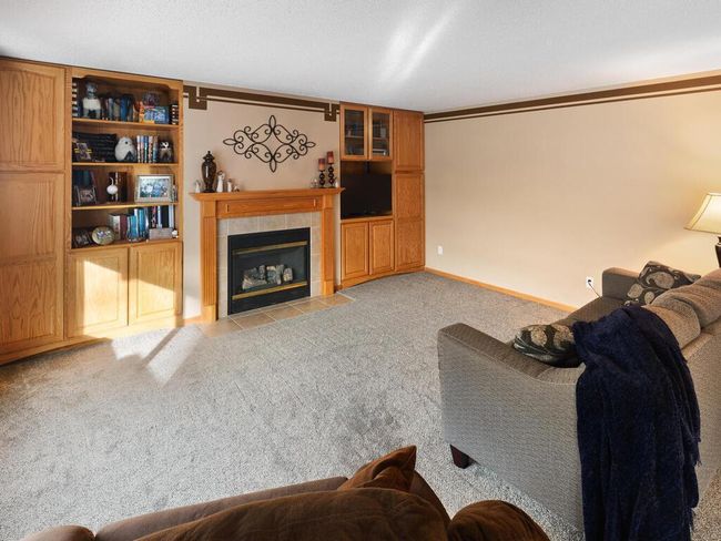 Family room with gas fireplace and built-in shelves | Image 21