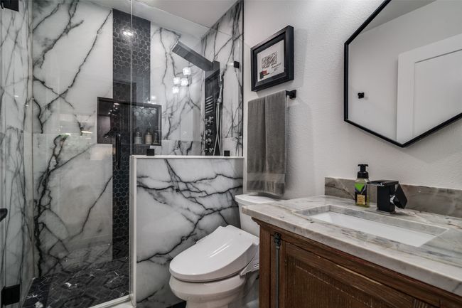 Full bathroom with vanity and a marble finish shower | Image 27