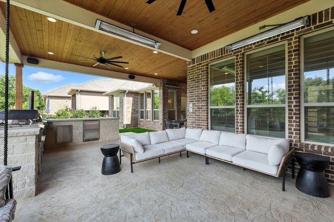 View of patio / terrace featuring a ceiling fan, an outdoor living space, and an outdoor kitchen | Image 32
