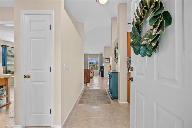 Entryway with baseboards and light tile patterned floors | Image 6