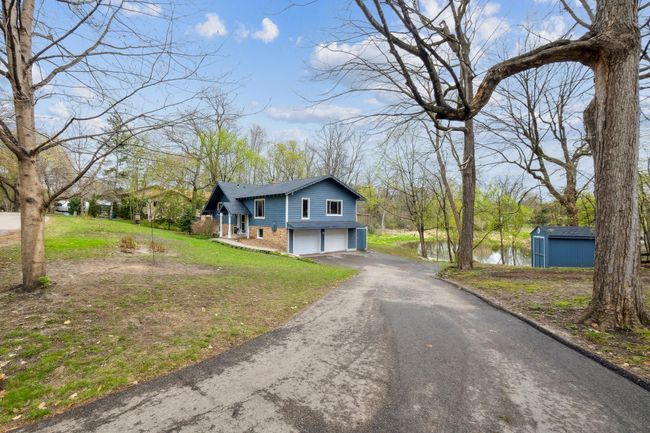 Large two car garage lots of parking. Separate dry storage shed and dog kennel. | Image 19