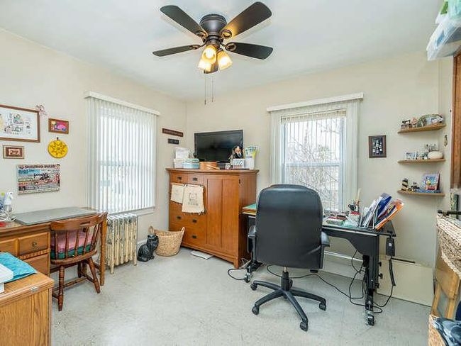 Office area featuring plenty of natural light and a ceiling fan | Image 10