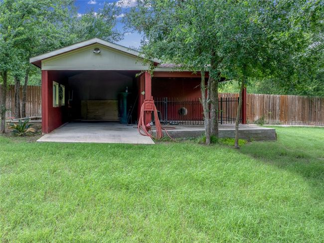 View of outbuilding featuring a fenced backyard | Image 32