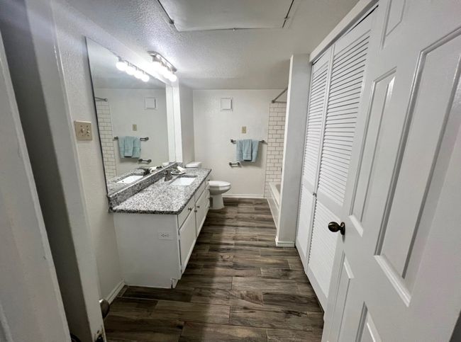 Full bath with baseboards, wood finished floors, vanity, and toilet | Image 10