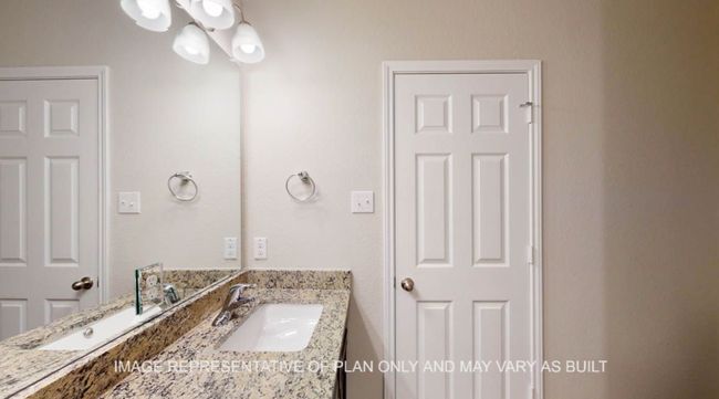 Bathroom with vanity and a chandelier | Image 18