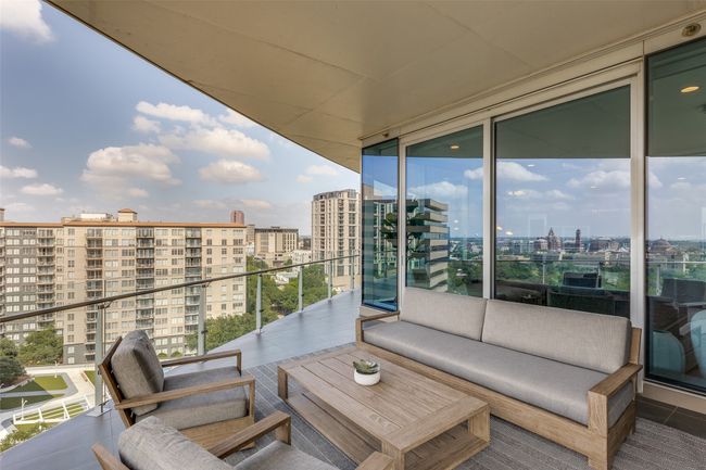 Balcony featuring a city view and an outdoor living space | Image 26