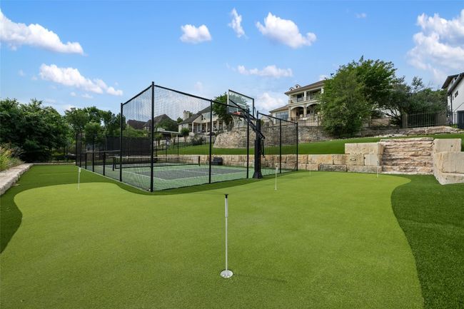 View of tennis court featuring a putting area | Image 26