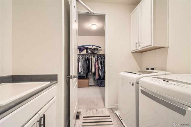 Washer and dryer included, utility sink and is adjacent to the primary suite closet. | Image 14