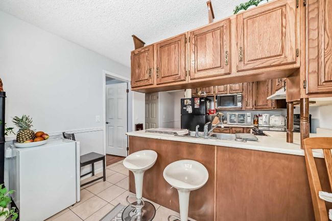 7 Hawksley Crescent Nw, Home with 4 bedrooms, 2 bathrooms and 4 parking in Calgary AB | Image 10