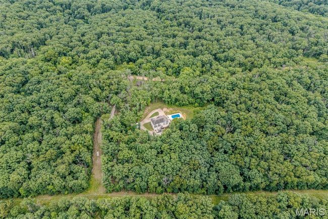 Aerial overview of property's location featuring a forest | Image 86
