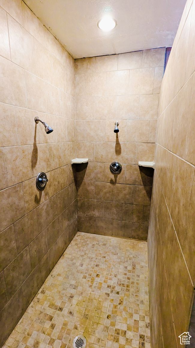 Bathroom featuring tiled shower | Image 39