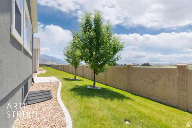Fenced backyard featuring a mountain view | Image 39