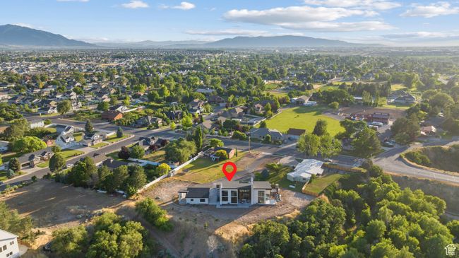 Aerial overview of property's location with nearby suburban area | Image 96