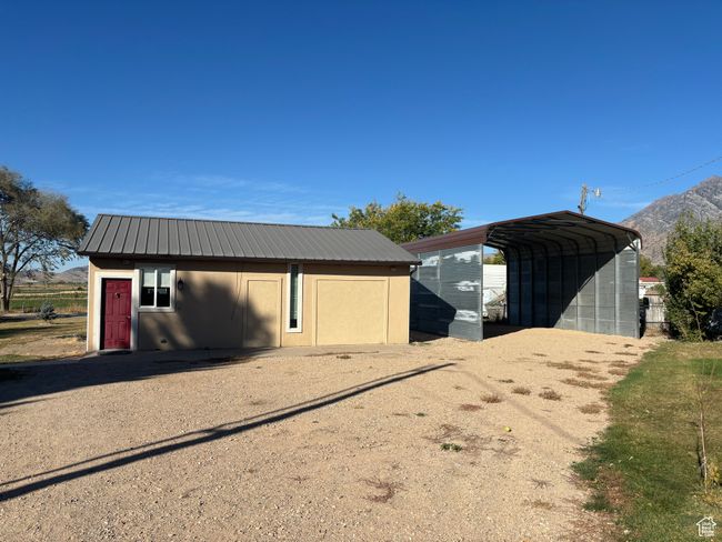 View of outdoor structure featuring a mountain view and a carport | Image 9
