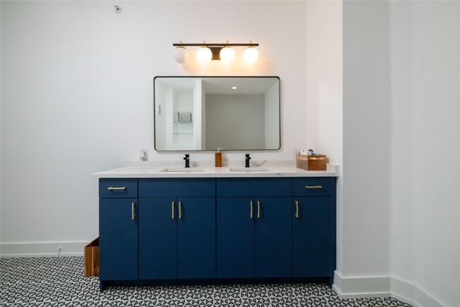 Full bathroom with double vanity and baseboards | Image 34