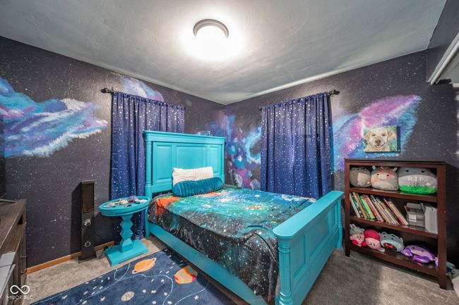 carpeted bedroom with baseboards and wallpapered walls | Image 16