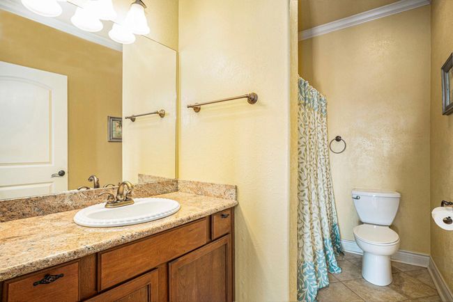Located at the top of the stairs and thoughtfully positioned between the secondary bedrooms, this full bathroom offers exceptional convenience for the upper level.second | Image 27
