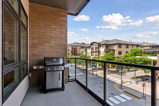 Outdoor spaces include this balcony located off the kitchen | Image 25