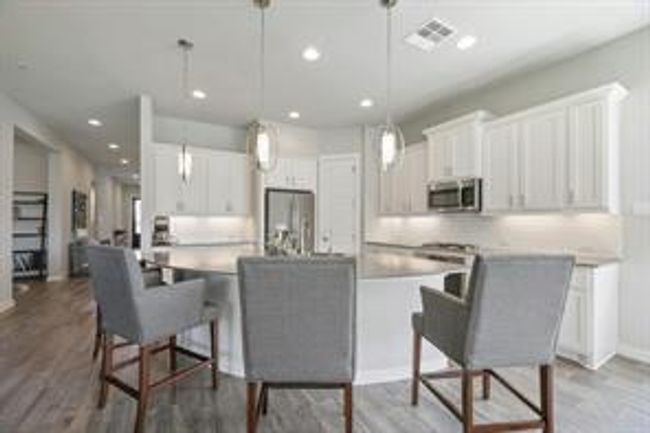 Dining area with recessed lighting and wood finished floors | Image 8