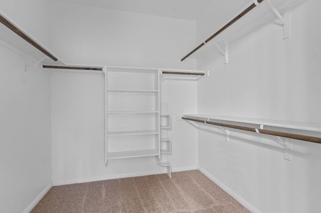 Walk in closet featuring carpet flooring | Image 21