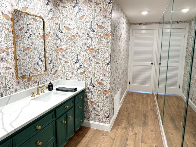 Bathroom with hardwood / wood-style floors and vanity | Image 22