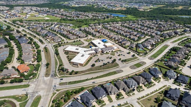 Aerial overview of property's location featuring a large body of water and nearby suburban area | Image 39