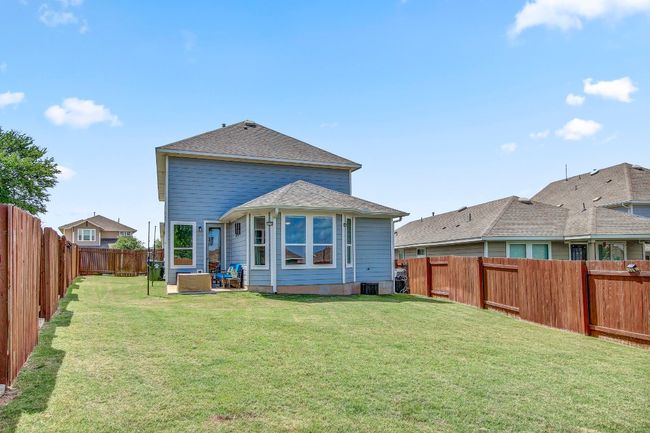 Back of house with a fenced backyard | Image 40