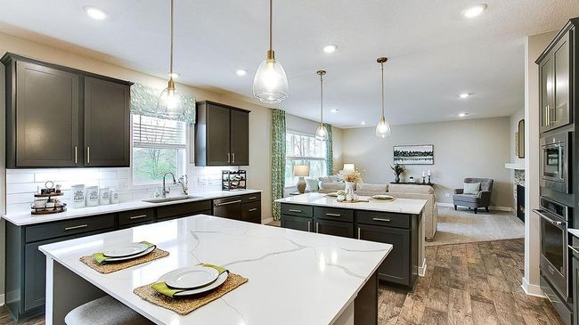 Two sets of pendant lights give a polished and elegant vibe! Photos of model home; Colors and options may vary. | Image 6