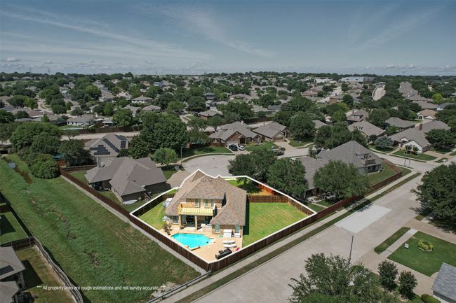 Aerial view of residential area with a pool area and property boundaries highlighted | Image 30