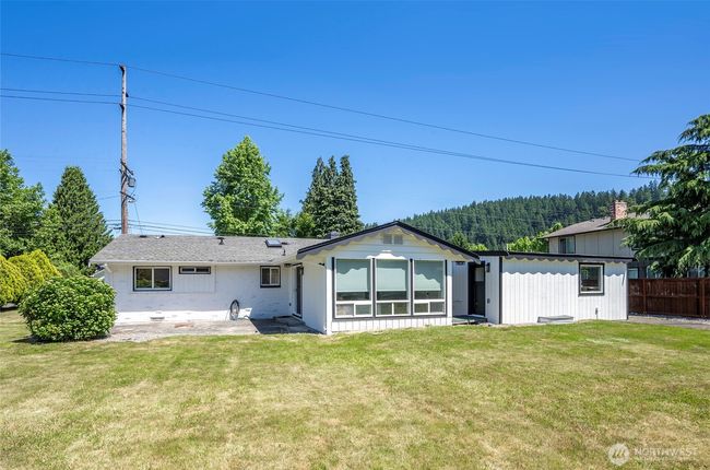 Flat, usable back yard highlights a key selling point for anyone who enjoys entertaining or simply wants a versatile outdoor space. | Image 22