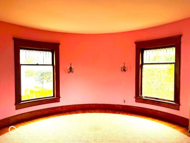 unfurnished room featuring baseboards and wood finished floors | Image 11
