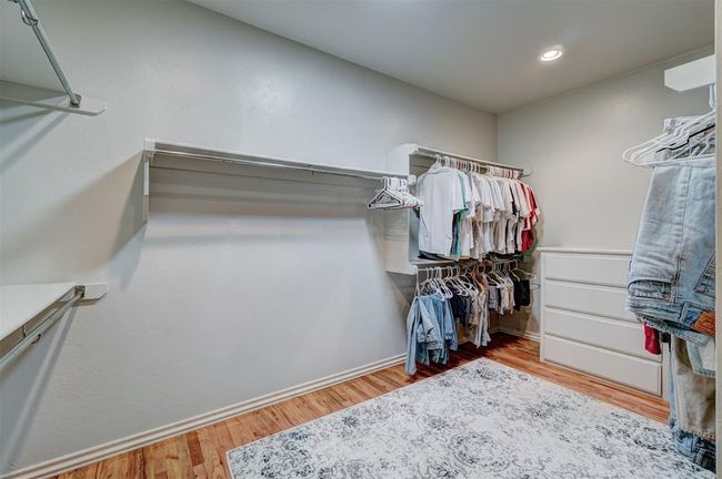 Walk in closet featuring wood finished floors | Image 28