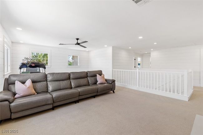 Living area featuring recessed lighting, visible vents, a ceiling fan, and light carpet | Image 36
