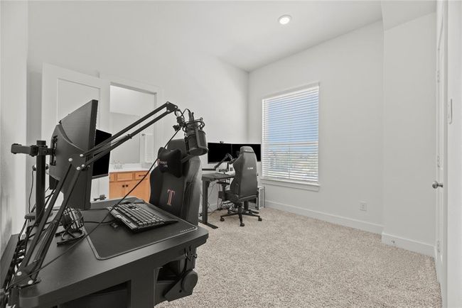 Secondary bedroom is currently furnished as a home office. | Image 17