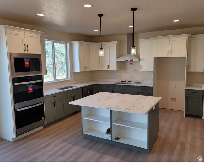 Huge Kitchen features a double wall oven with microwave above, a gas drop-in range, a range hood, and a dishwasher. (A fridge will NOT be included.) | Image 5